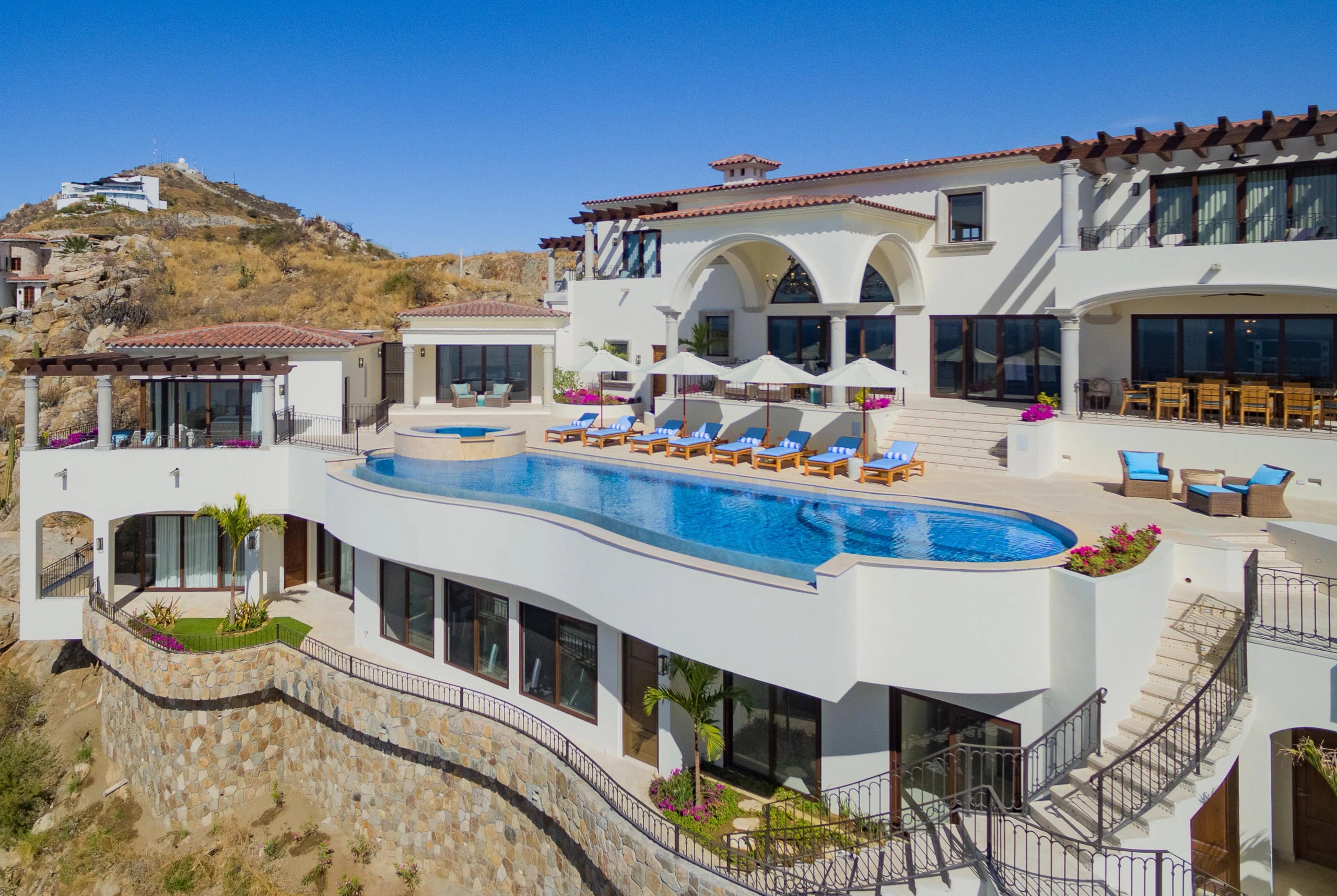 A luxury home with an infinity pool on a Los Cabos hillside