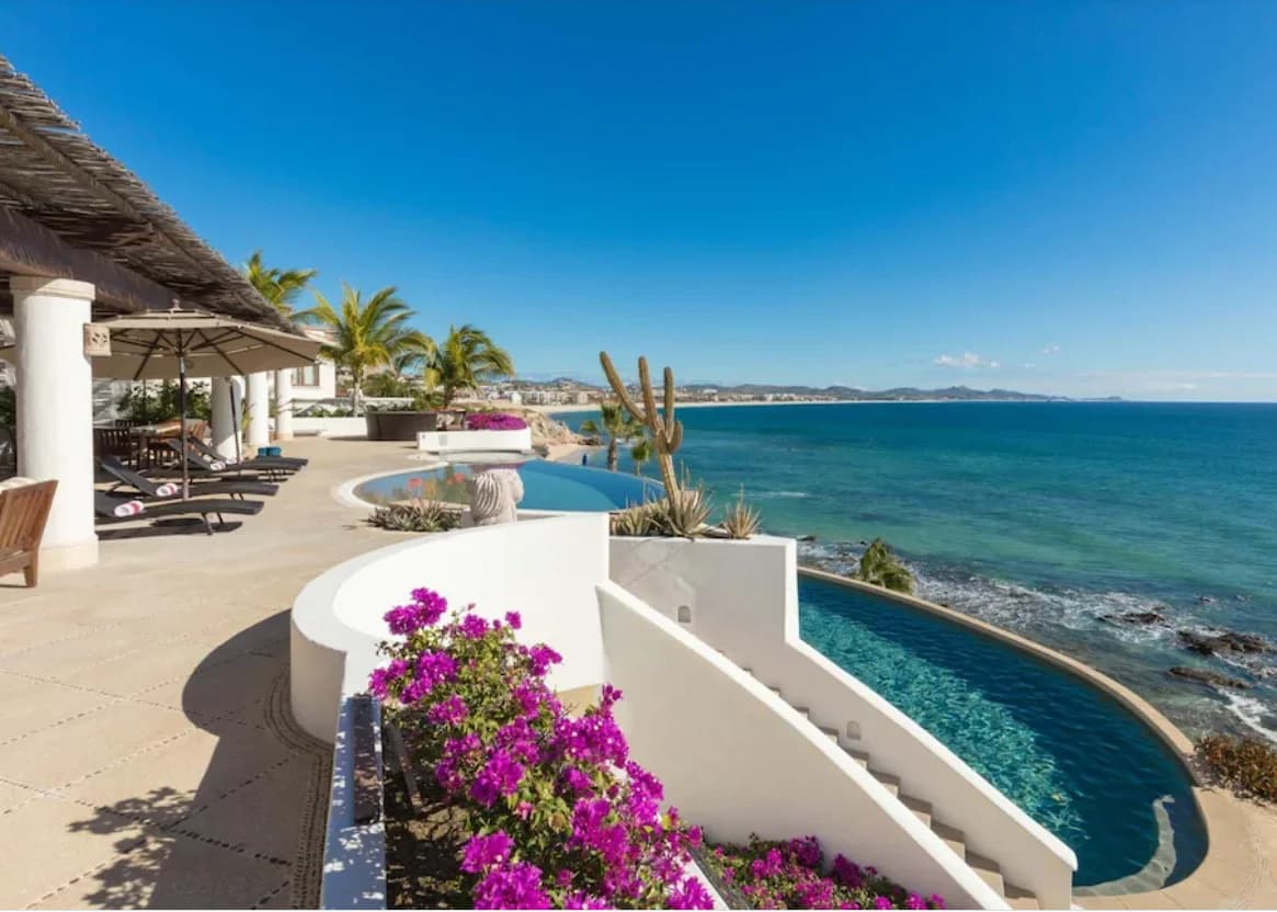 Infinity pool at Buying Guide for Los Cabos (2026) with ocean and bougainvillea