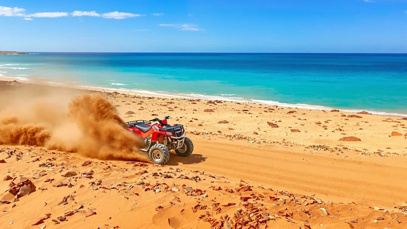 Atv on beach at Cabo Adventure Tours That Combine Desert & Ocean Activities red atv, ocean beyond