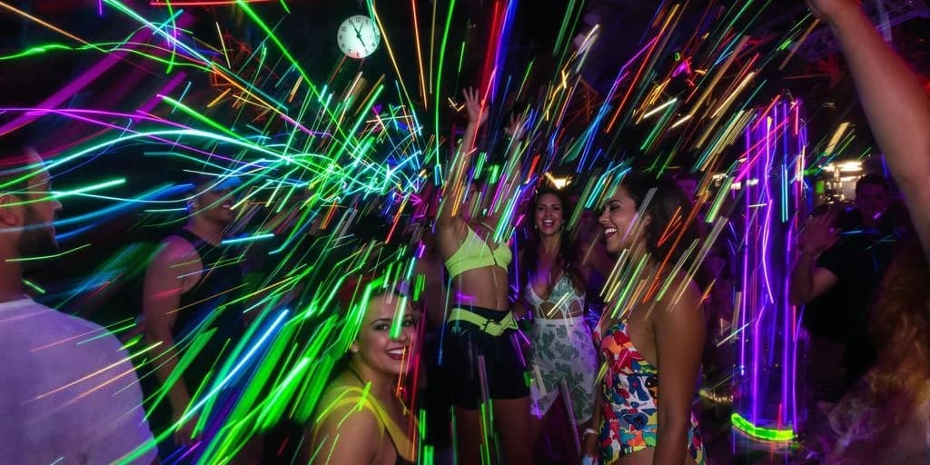 Nightclub dancefloor at Cabo Nightlife 2026: What You Need to Know people dancing with neon light trails