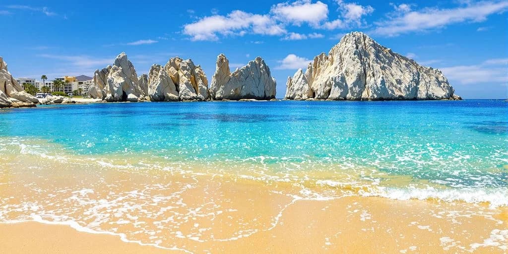 Beach rock formations at Cabo San Lucas Real Reviews: What You Need to Know with clear water, blue sky