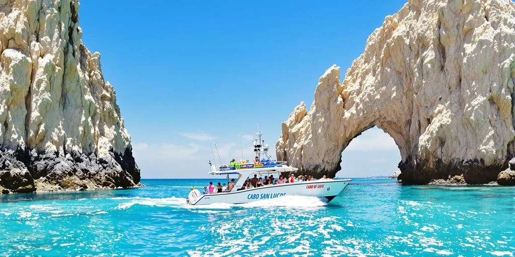 Tour boat at Cabo Tour Reviewed: What You Need to Know people on board, rock formation