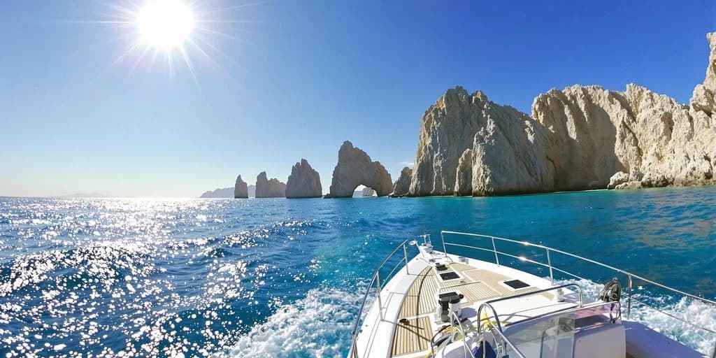 Yacht bow view 1 at Cabo Yacht Locals Recommend: What You Need to Know towards rock formations, sunny day