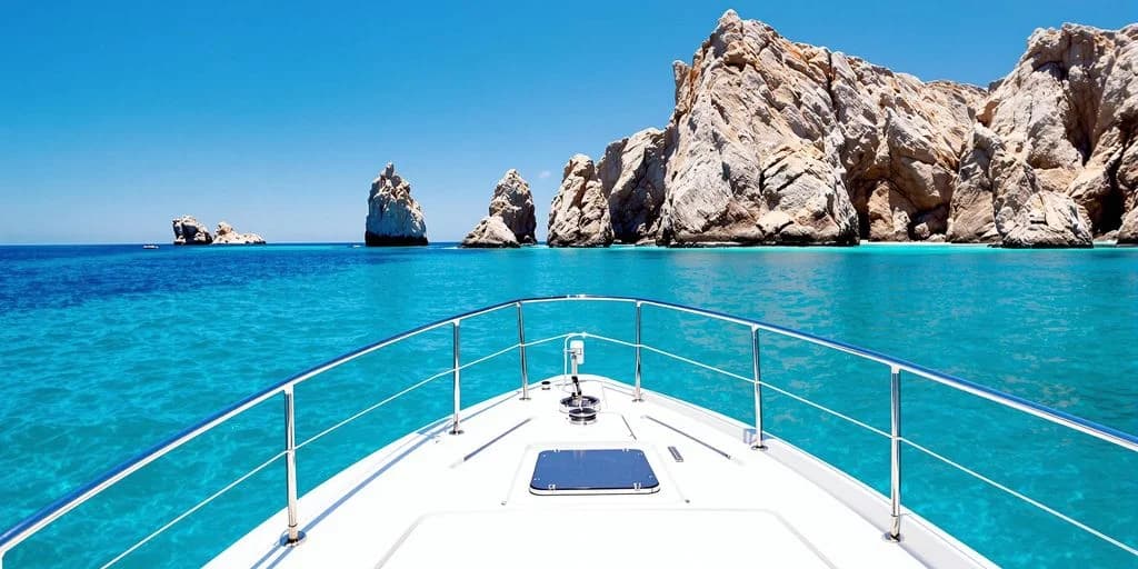 Yacht bow view 3 at Cabo Yacht Ranked: What You Need to Know towards rock formations, clear day
