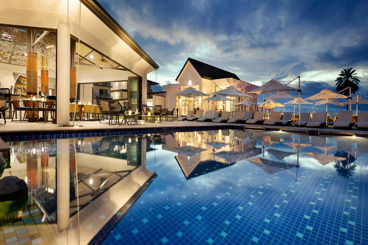 Resort pool area at Drift Hotel & Kitchen in San José del Cabo: Who It Suits and What to Expect at dusk with building