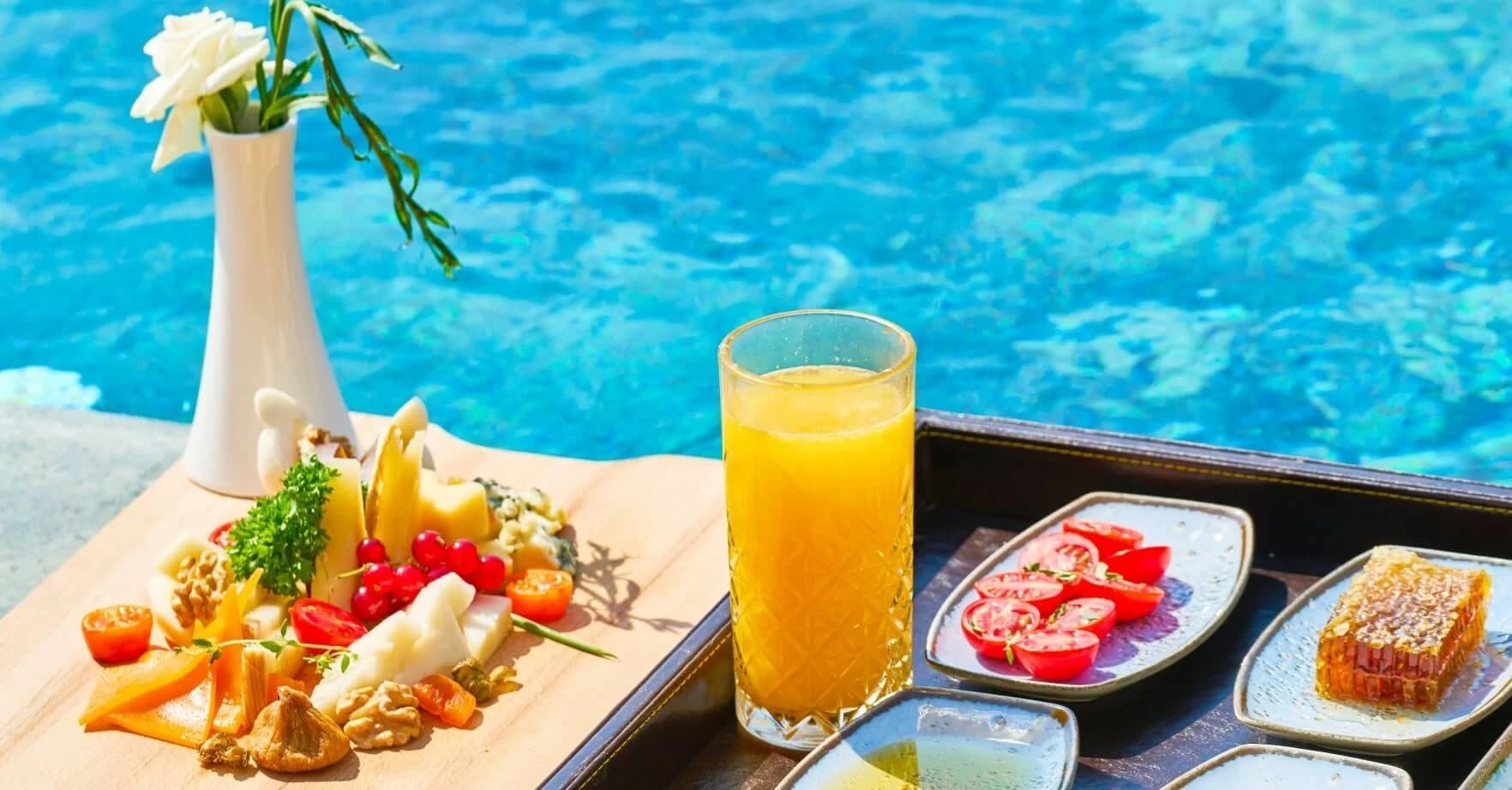 Orange juice at Savoring the Sun: How to Eat Healthy and Delicious While Immersed in Cabo's Culinary Soul close-up, by a pool