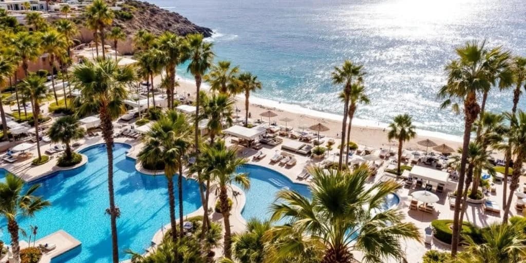 Beach resort aerial at ME Cabo Is Where Luxury Meets the Vibrant Cabo Scene with pool and ocean, sunny day