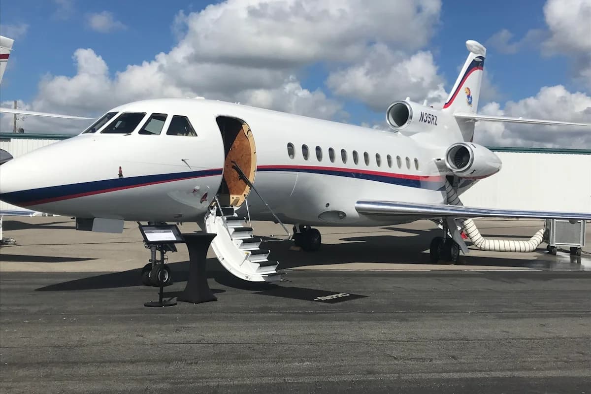 Private jet at Private Jet to Cabo: $25,000 vs $50,000 to Other Destinations on tarmac, door open