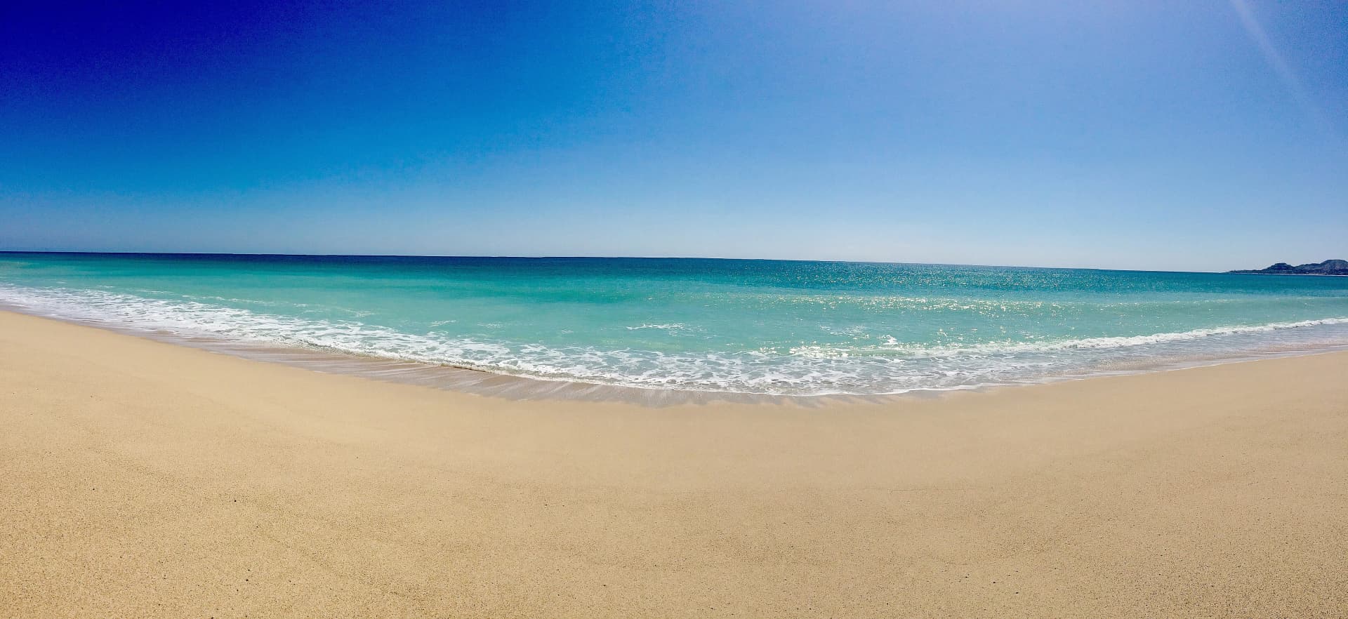Sandy beach at Is Cabo San Lucas Safe? Your Complete 2026 Travel Safety Guide with gentle waves, clear sky