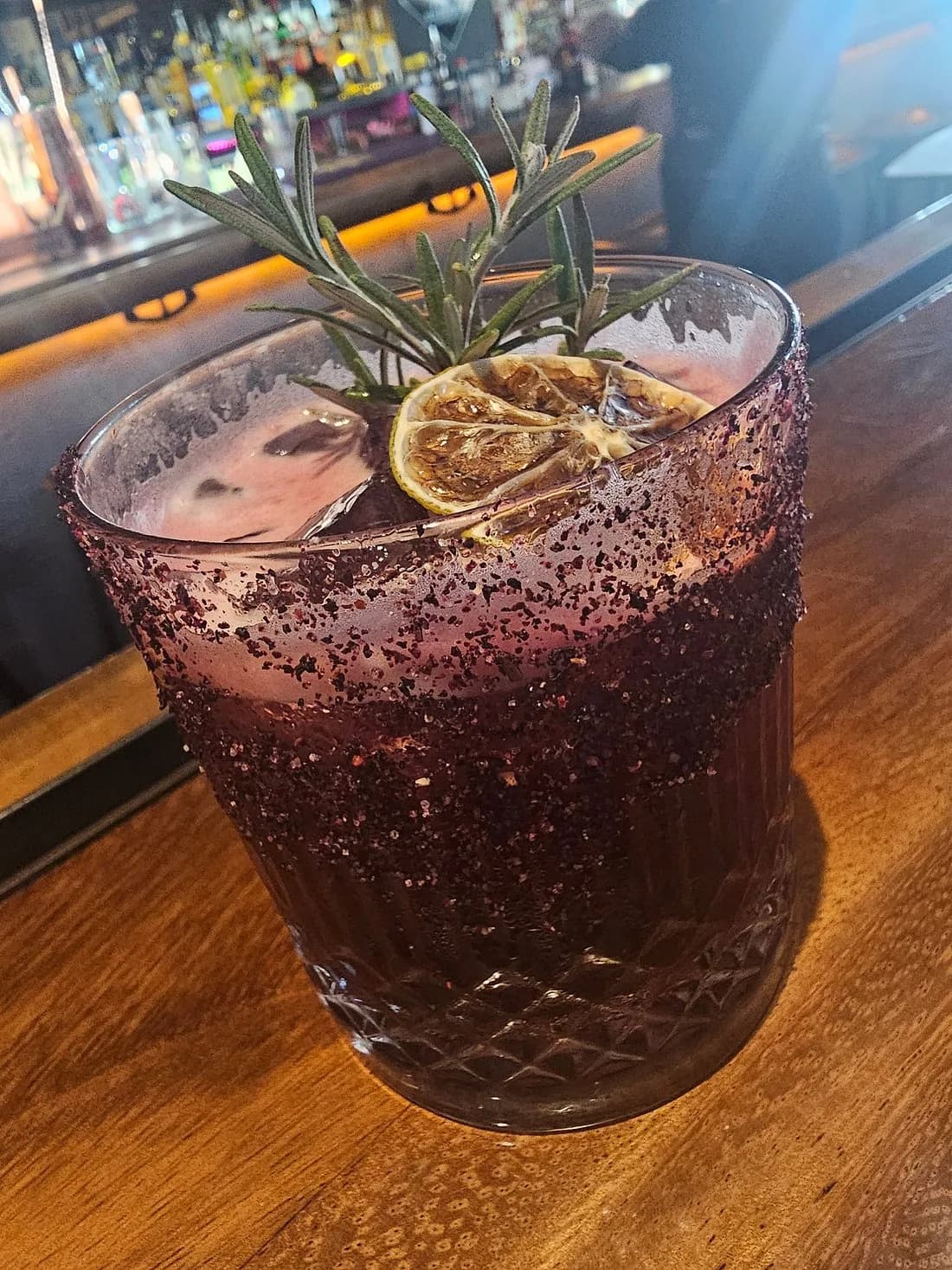 Cocktail drink at Private Bartender & Mixology with lime and rosemary garnish in Los Cabos