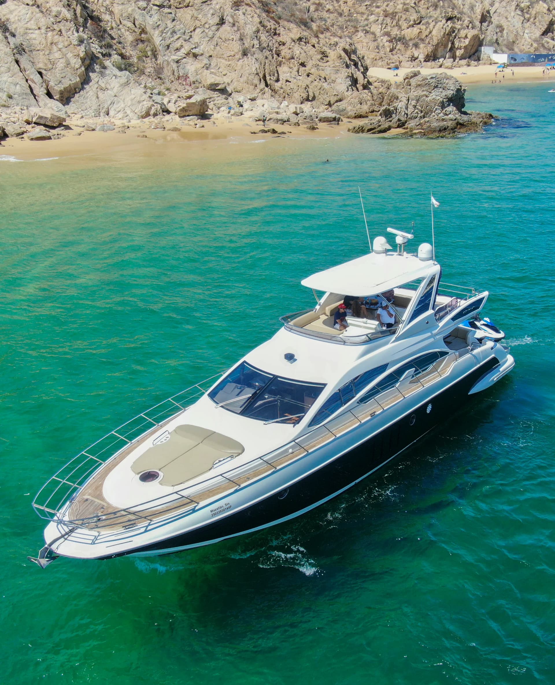 Luxury yacht cruising past the Arch of Cabo San Lucas