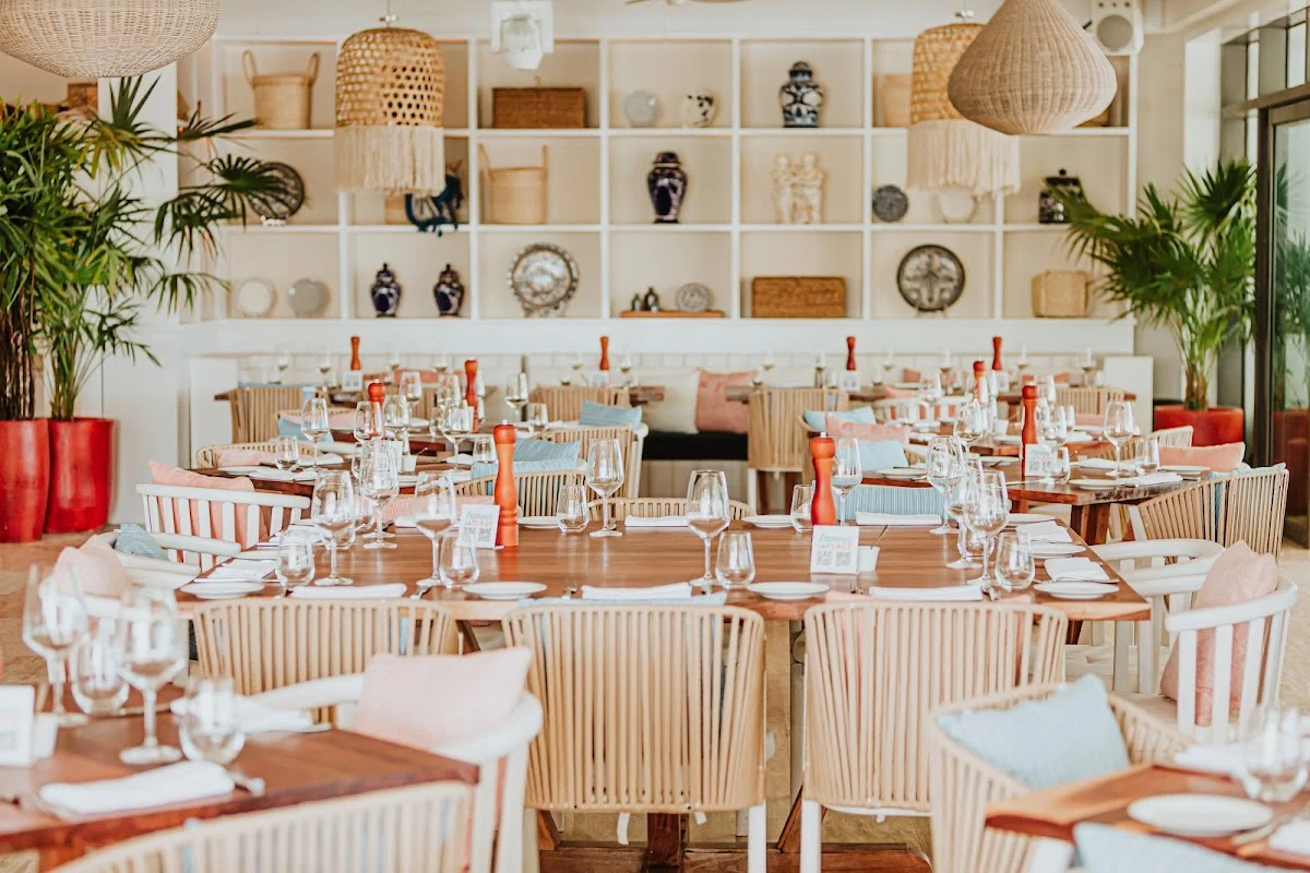 Dining room at Bagatelle Los Cabos with decorative shelves