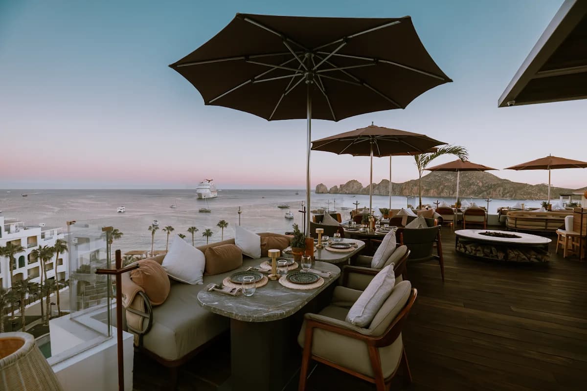Rooftop restaurant at Craft Los Cabos with ocean view, at dusk in Cabo San Lucas