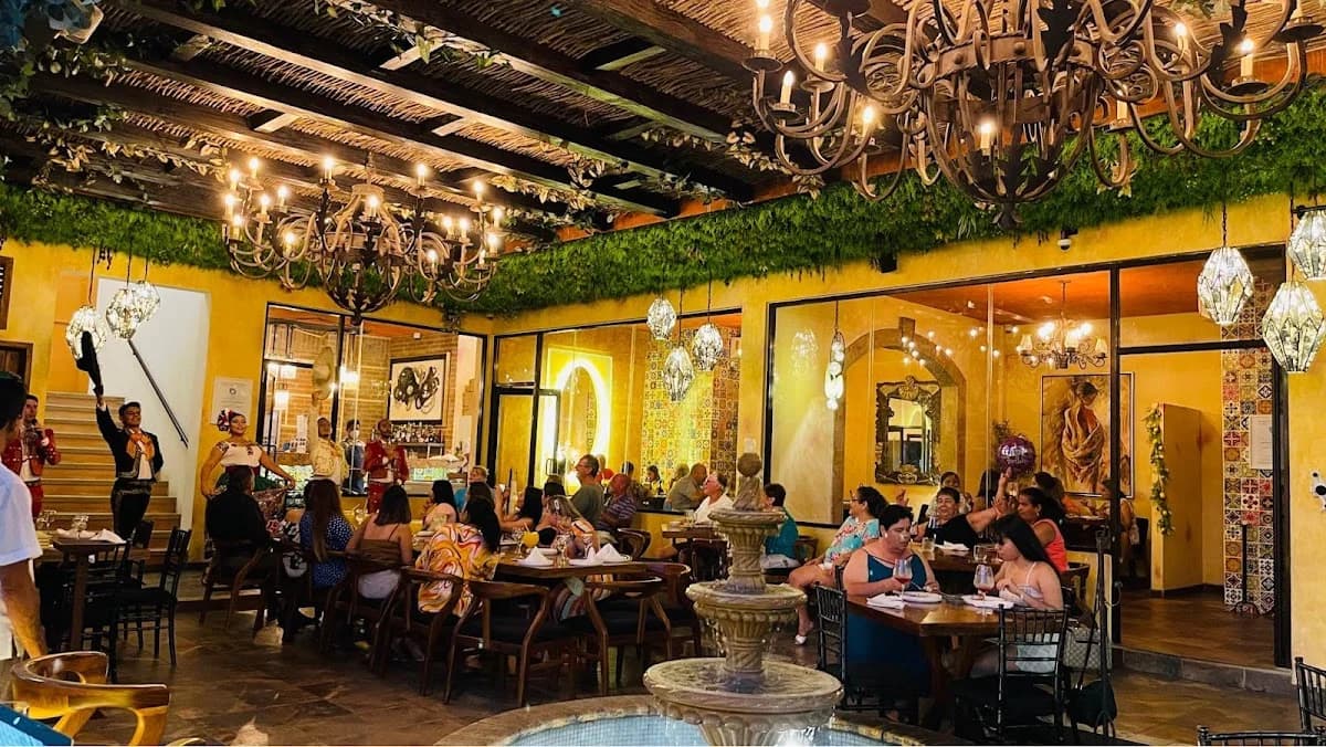 Restaurant interior at Fiorenza Italian Restaurant with fountain, people dining in San José del Cabo