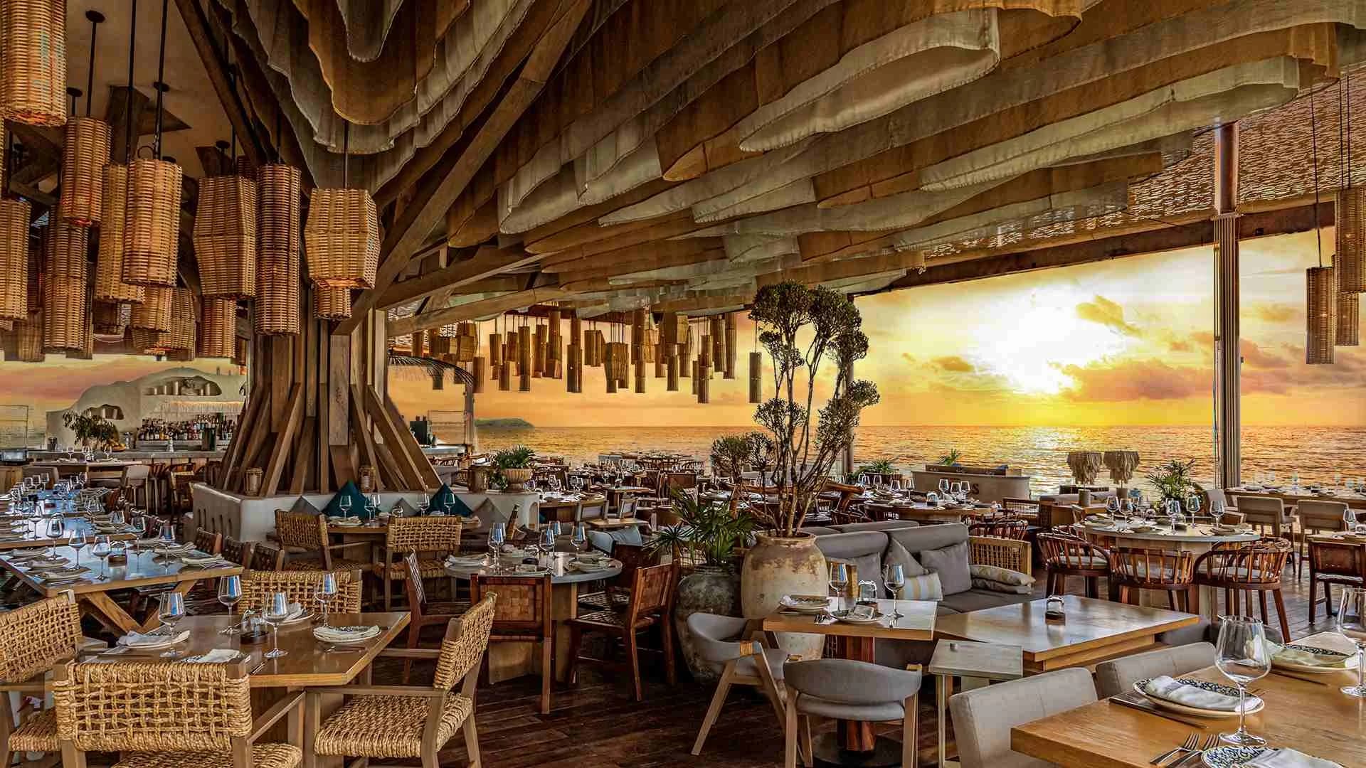 Restaurant interior at Ilios at sunset, ocean view in Cabo San Lucas