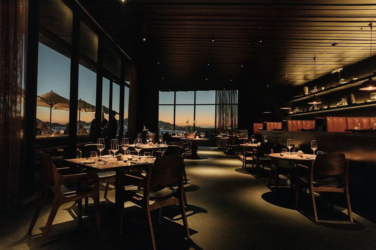 Fine dining room at Manta at dusk, city view in Cabo San Lucas