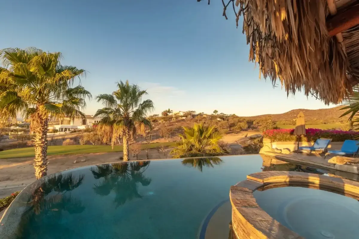 Infinity pool 2 at Casa Corona with desert hills beyond in Cabo Del Sol