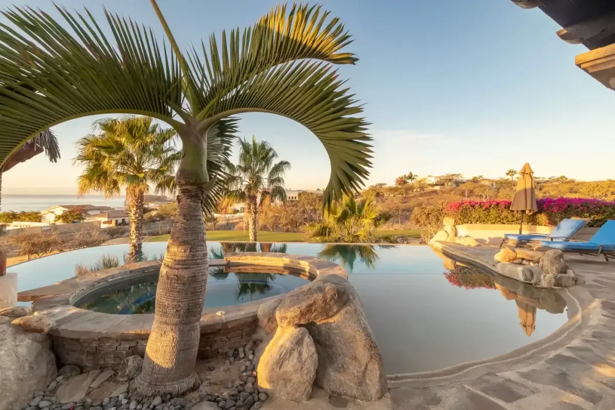Infinity pool 3 at Casa Corona with hot tub, palm frond in Cabo Del Sol