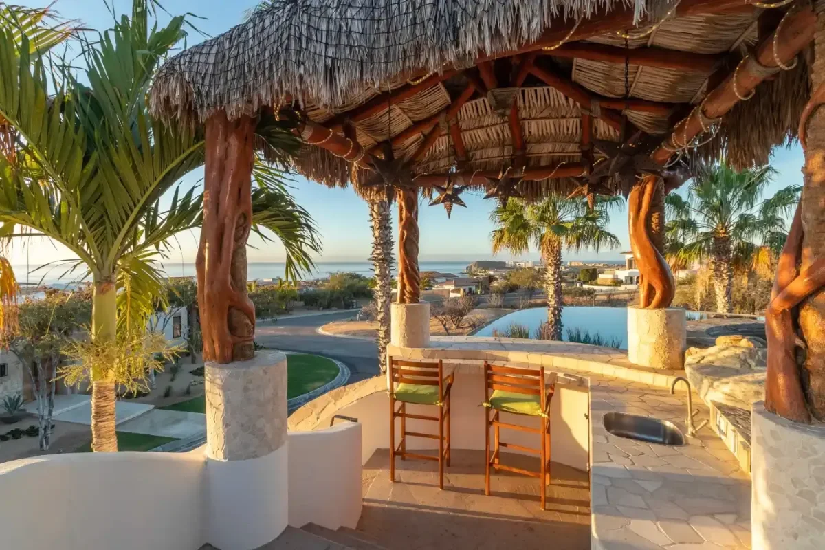Outdoor bar at Casa Corona under palapa, with ocean view in Cabo Del Sol