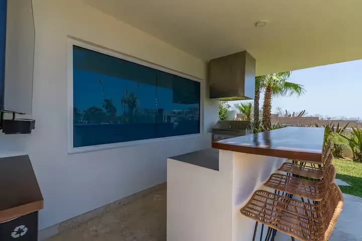 Outdoor kitchen at Unfurl the Sails: Your Definitive Guide to Luxury Yacht Charters in Cabo San Lucas with grill and bar