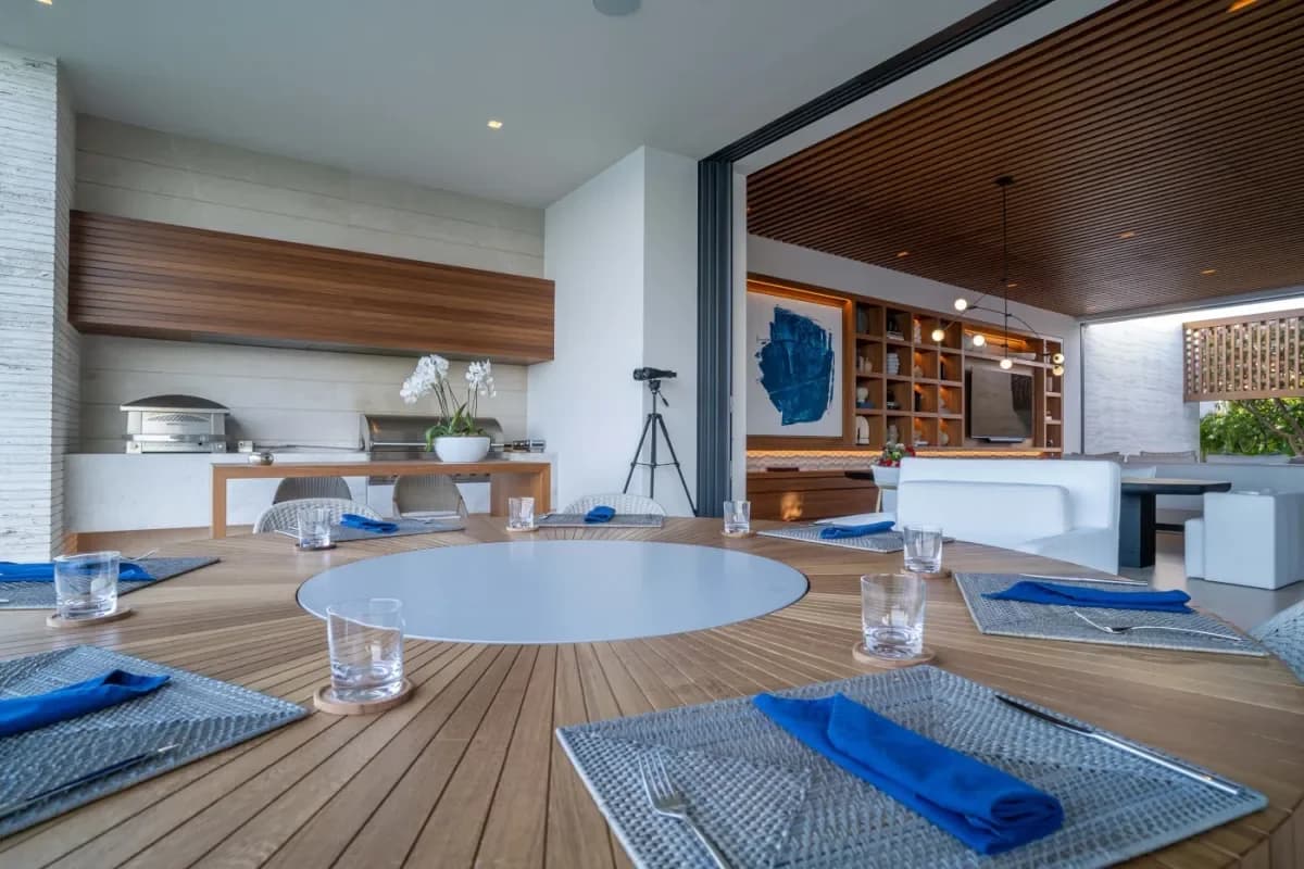 Outdoor dining table at Casa Elije with binoculars, wooden surface