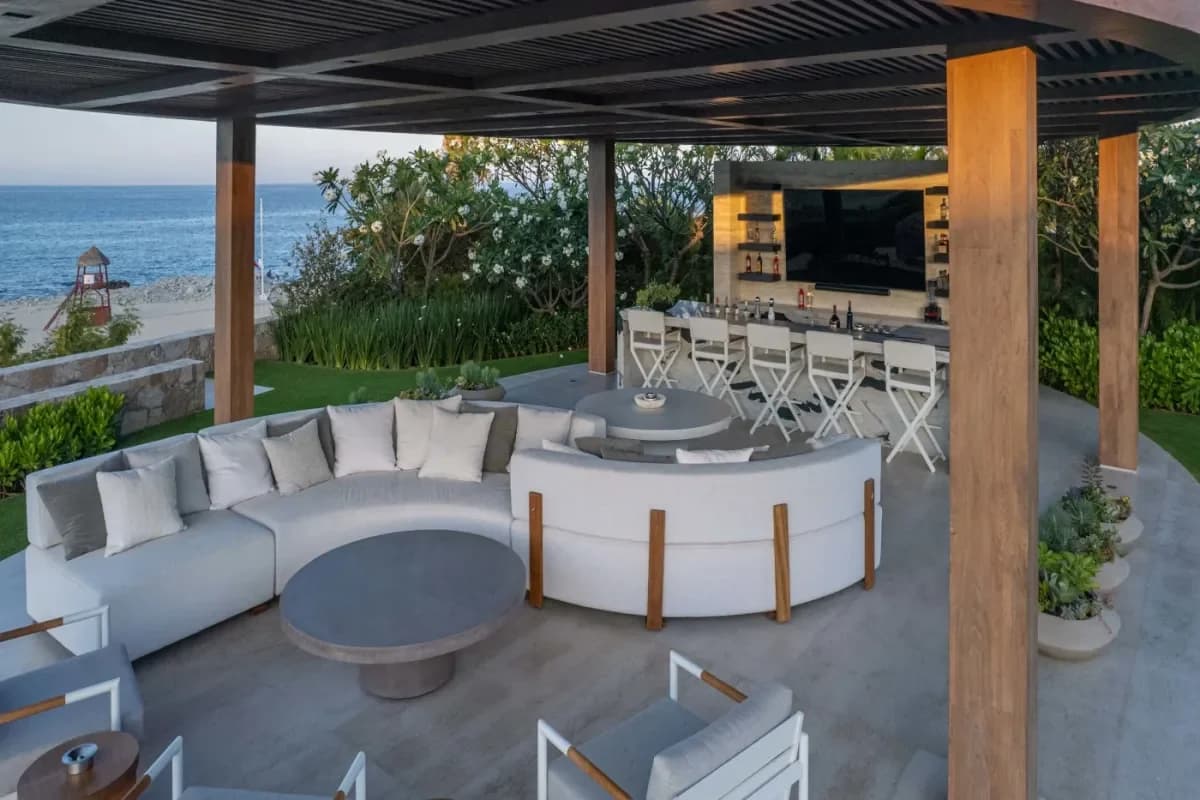 Outdoor lounge at Indulge in Bliss: The Best Resort Spas in Cabo's Corridor for 2026 with bar, lush greenery