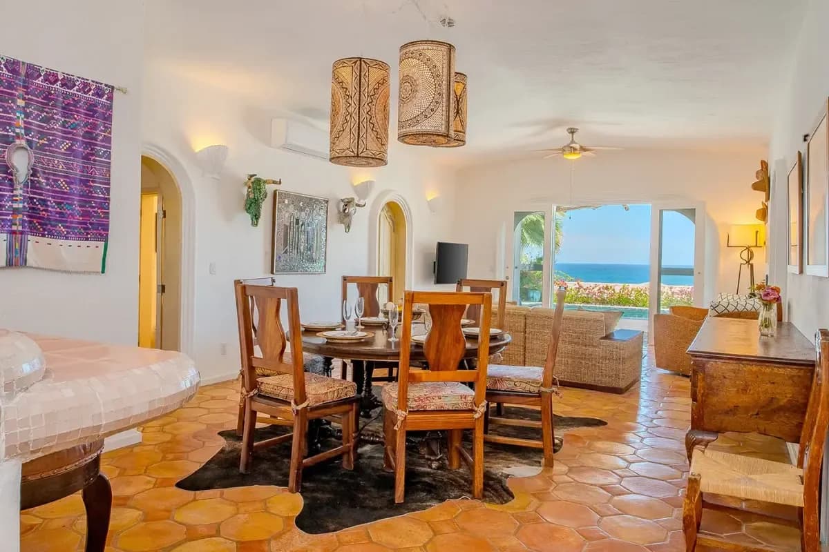 Dining room 1 at The Ultimate Cabo Villa for Your Wedding Party: A 2026 Guide with decorative pendant lights