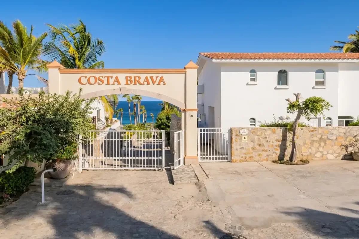 Entrance gate at My 2026 Guide to Cabo Real Golf: A Concierge's Favorite Course with archway, ocean view beyond