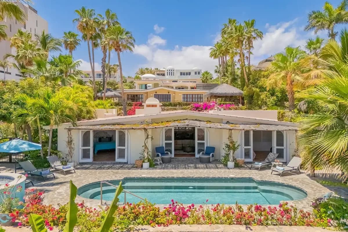 Exterior facade at Cabo San Lucas Beachfront Land for Sale: Your 2026 Investment Guide with pool, multiple buildings, palm