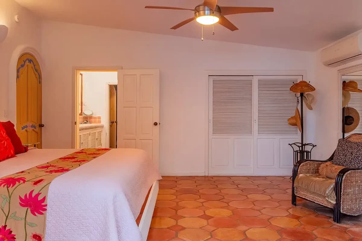 Primary bedroom 3 at Experience Seamless Arrival: VIP Airport Transfer Cabo San Lucas in 2026 with terracotta floor, white