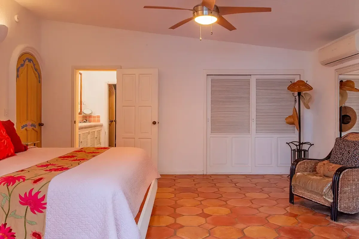 Primary bedroom 3 at Experience Seamless Arrival: VIP Airport Transfer Cabo San Lucas in 2026 with terracotta floor, white