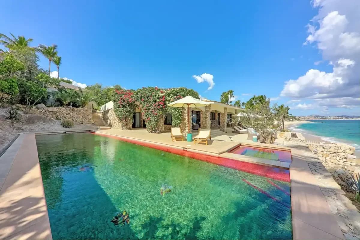 Pool area 3 at ¡Descubre los hoteles de Cabo San Lucas que ofrecen ofertas increíbles! with bougainvillea, sunny day