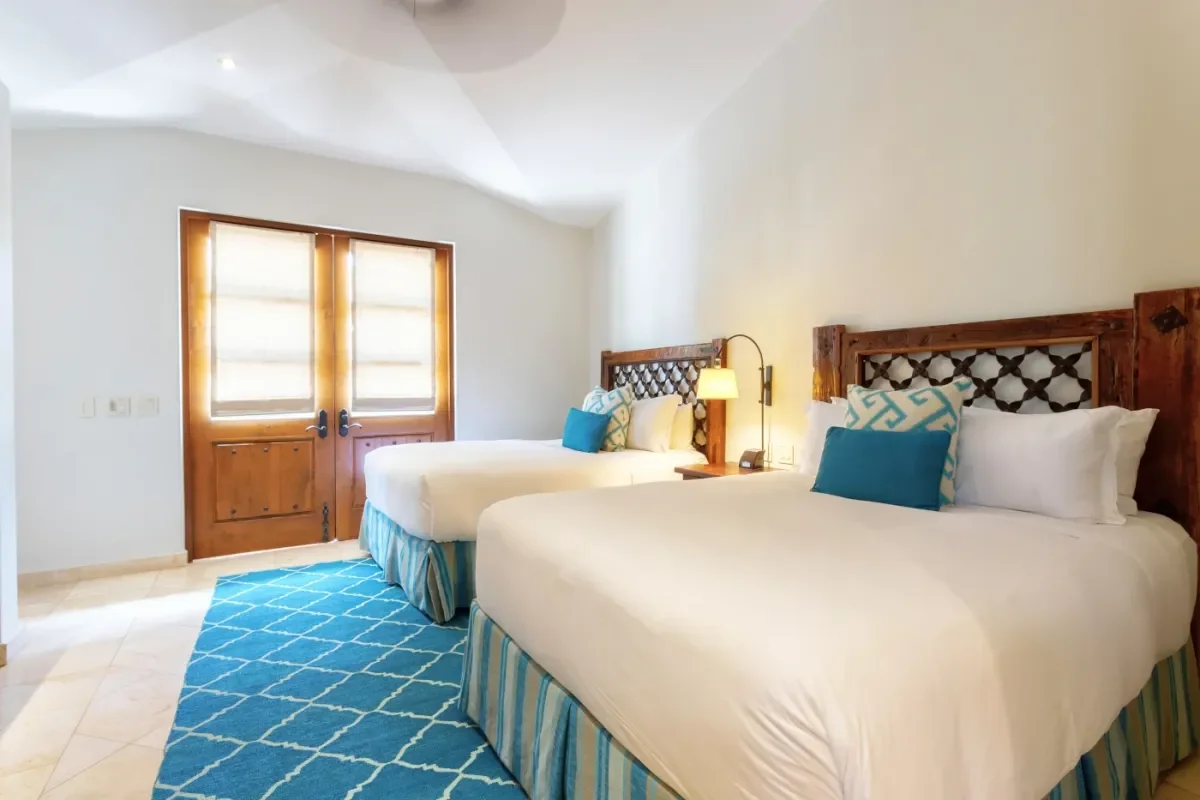 Bedroom 2 at Foreign Buyers Cabo Real Estate Process 2026: Your Definitive Guide two queen beds, window