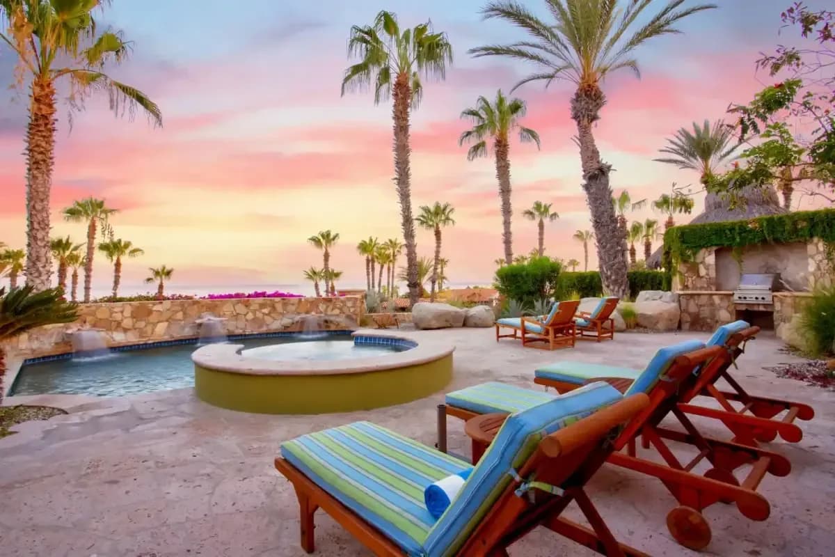 Hot tub at Planning a Cabo Trip from Seattle: Your Ultimate Guide at sunset, with palm trees