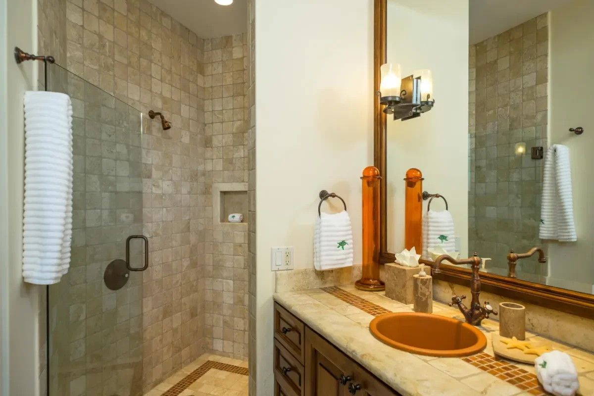 Bathroom vanity at The Invisible Architects of Indulgence: What to Expect from Your Private Villa Staff in Cabo with tiled