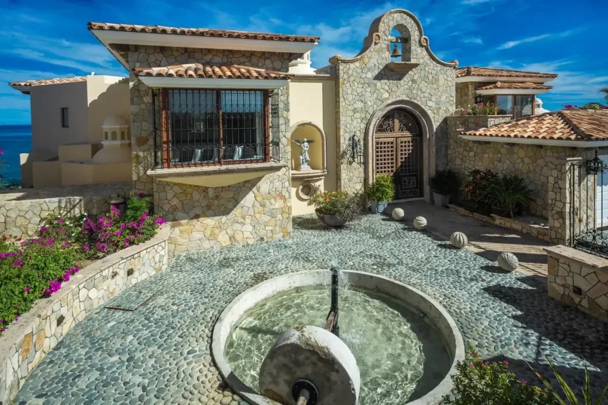 Courtyard fountain at Investing in Paradise: Your 2026 Guide to Cabo San Lucas Rental Income Property with stone facade and