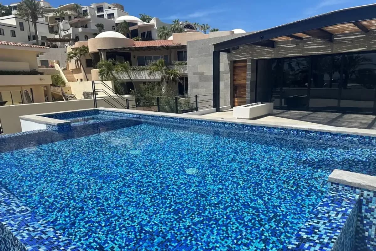 Swimming pool at Seamless Cabo San Lucas Wedding Transportation for Guests in 2026 with modern building exterior