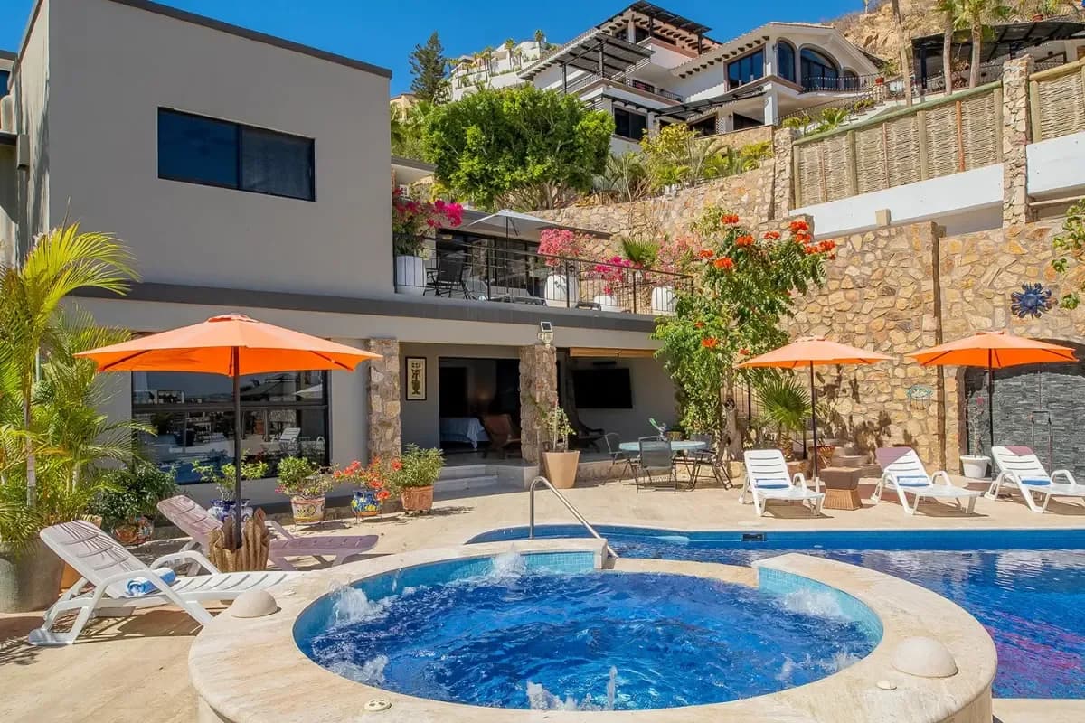 Hot tub at Your Dream Villa with Boat Access in Cabo San Lucas: 2026 Luxury Yachting Guide with multi-level building behind