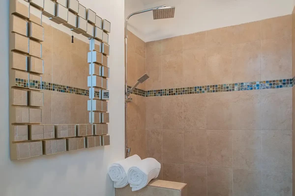 Shower stall at Pedregal Cabo Villa Rentals: Your Guide to Ultimate Luxury in 2026 with rain shower head and tiles