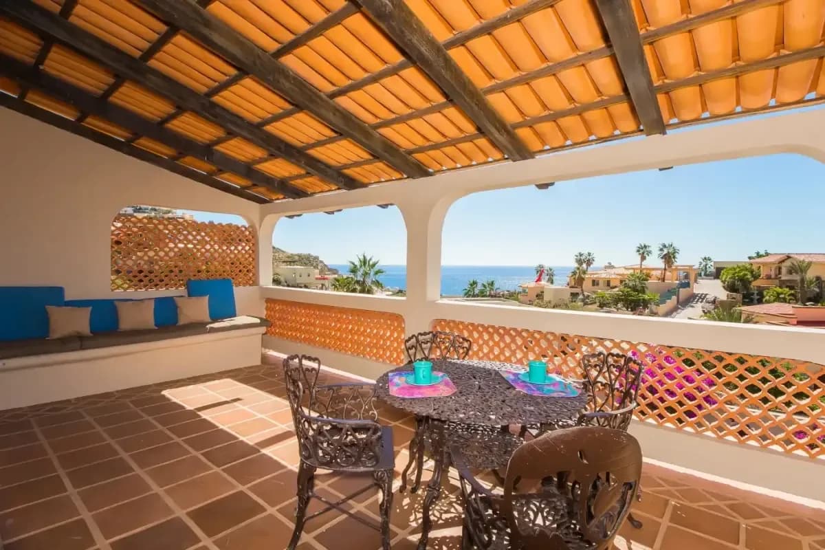 Covered terrace at Rodrigo's 2026 Guide: Finding Property in Cabo for Sale with dining table, ocean view