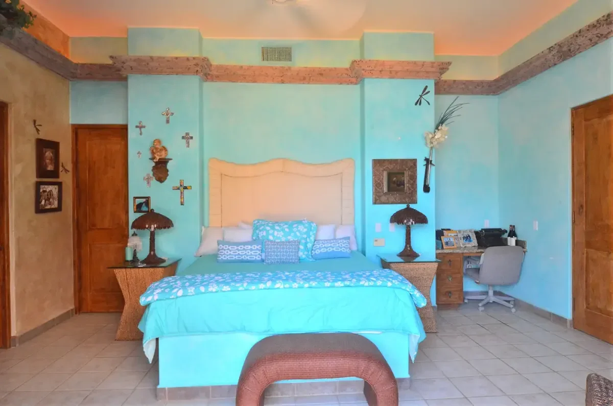 Bedroom 1 at Cabo Trip Planning: The Local Expert Alternative to DIY with blue and white bedding