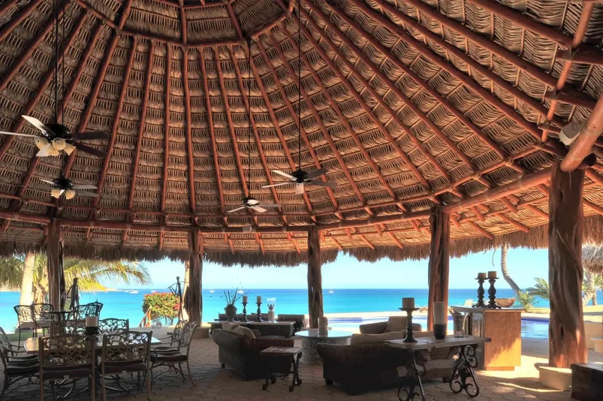 Palapa interior at Discover Unrivaled Luxury: Palmilla Villas for Rent in Cabo 2026 with ocean view at dusk