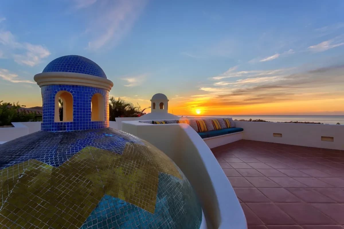 Rooftop terrace at Cabo Bachelor Party at sunset, with ocean view
