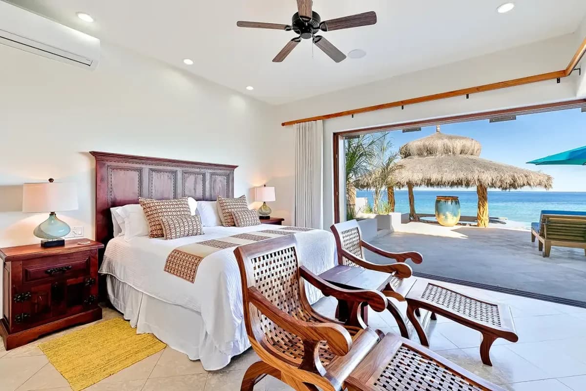Bedroom 2 at Secure Your Dream Cabo San Lucas Villa for New Year's Eve 2026 with ocean view, wooden chairs