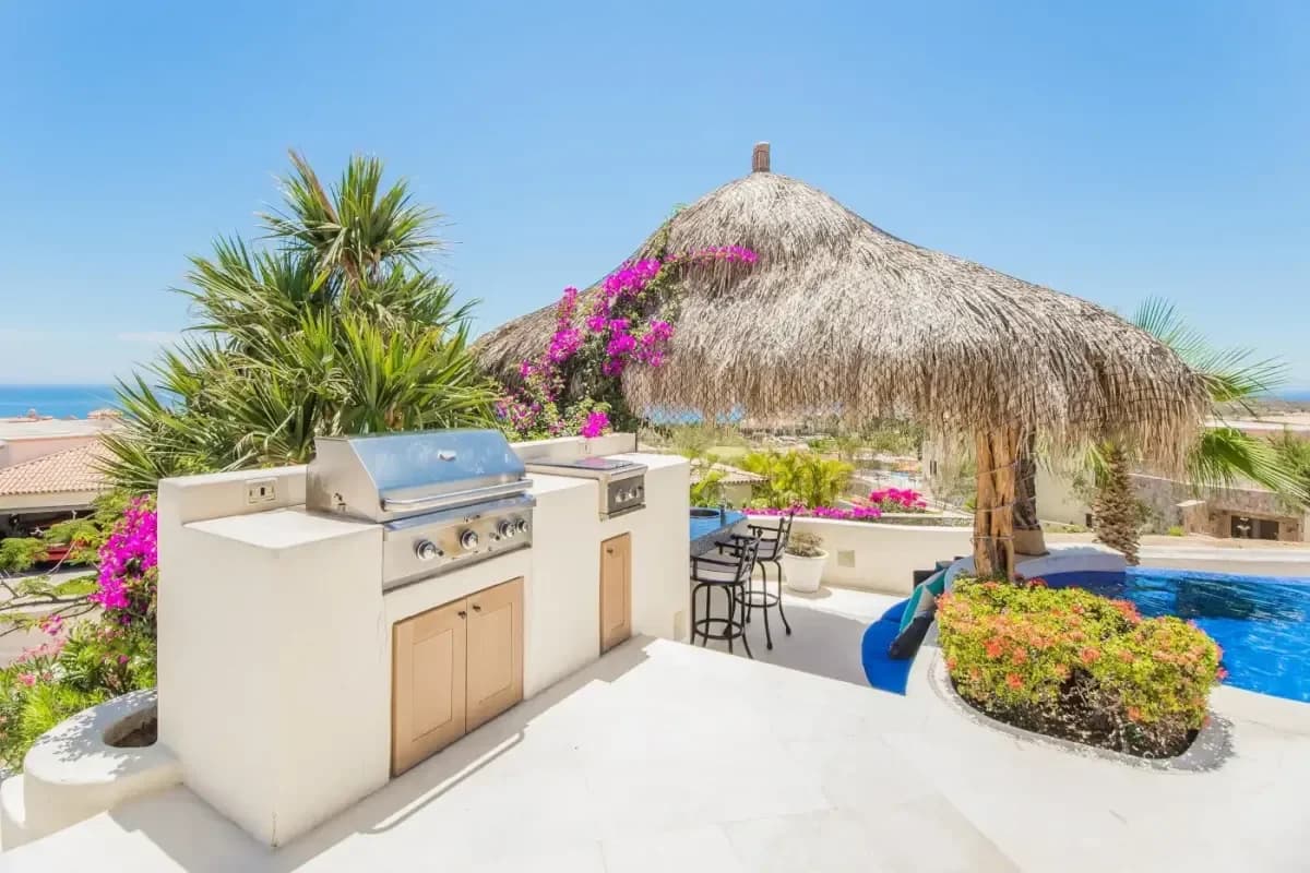 Outdoor kitchen at Elevate Your Cabo Escape: Luxury & Exotic Car Rentals in 2026 with palapa and bougainvillea