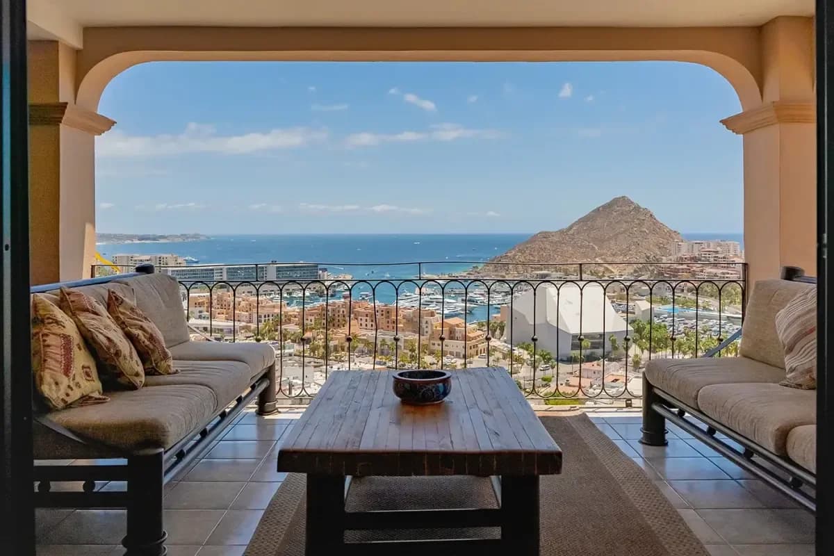 Outdoor dining table at Villa California with ocean and marina view in Pedregal Bay