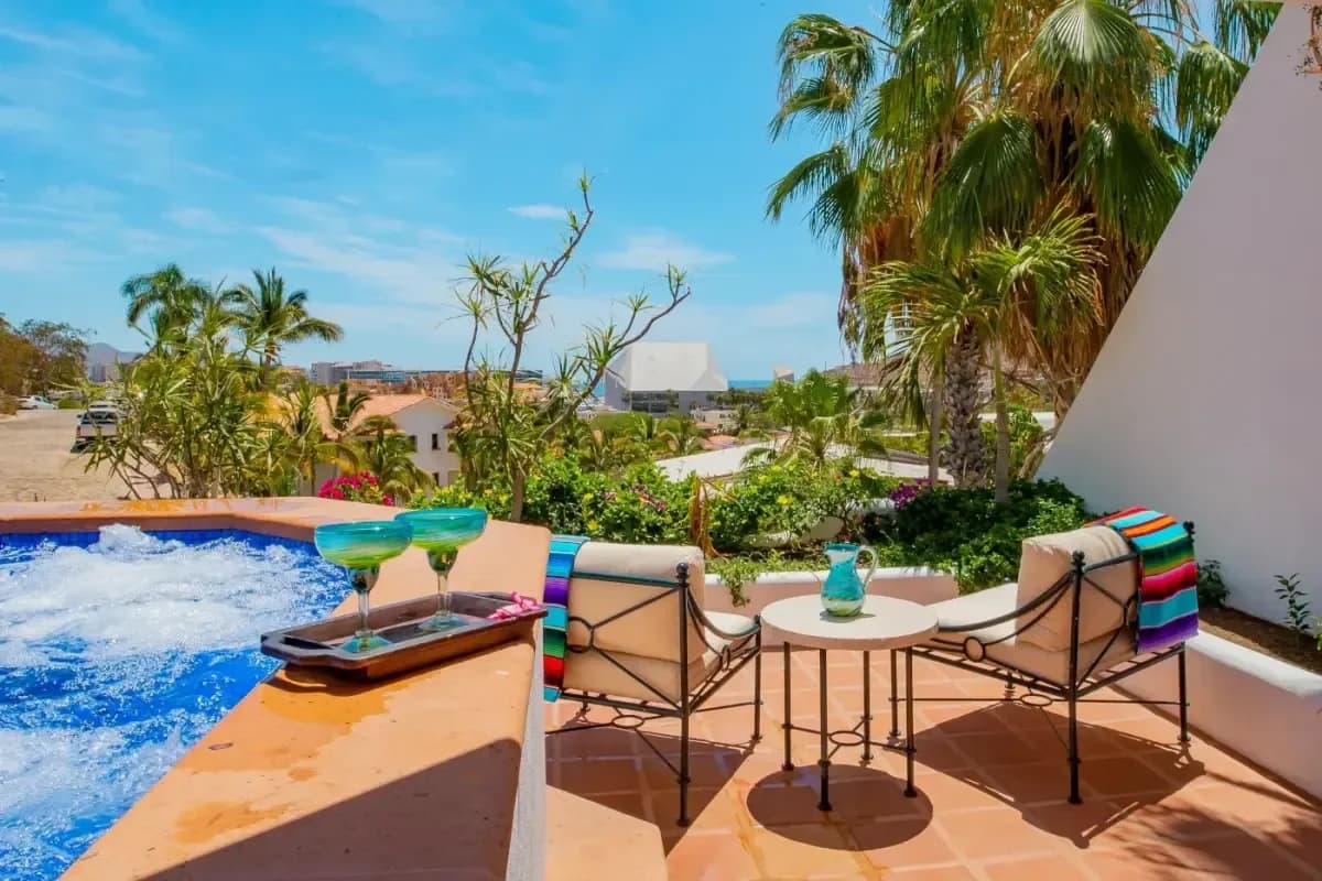 Outdoor terrace at Your 2026 Cabo San Lucas Wedding DJ & Live Music Guide with ocean view, lounge chair