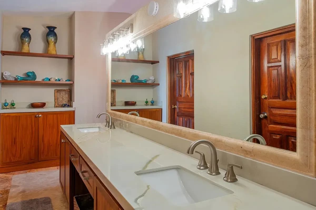 Bathroom vanity 1 at Cabo Weather August with double sinks and mirror
