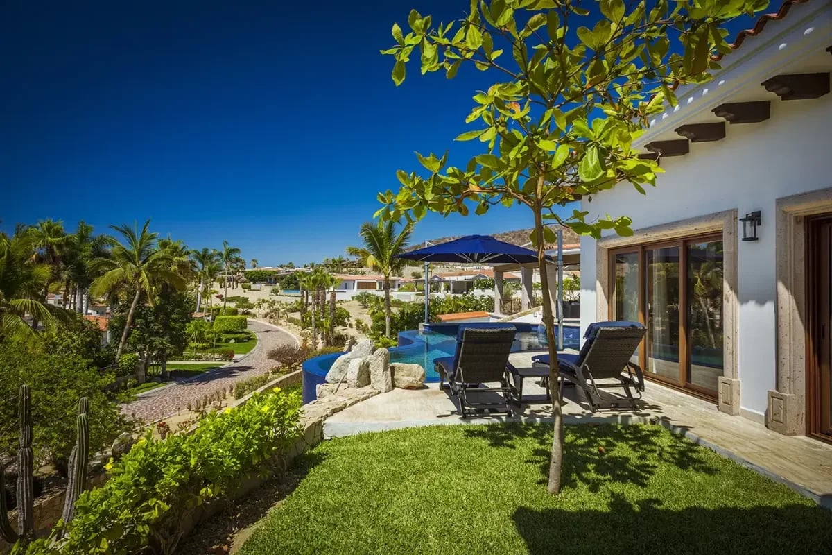 Pool area at Villa Esperanza with lounge chairs, bright day in Palmilla