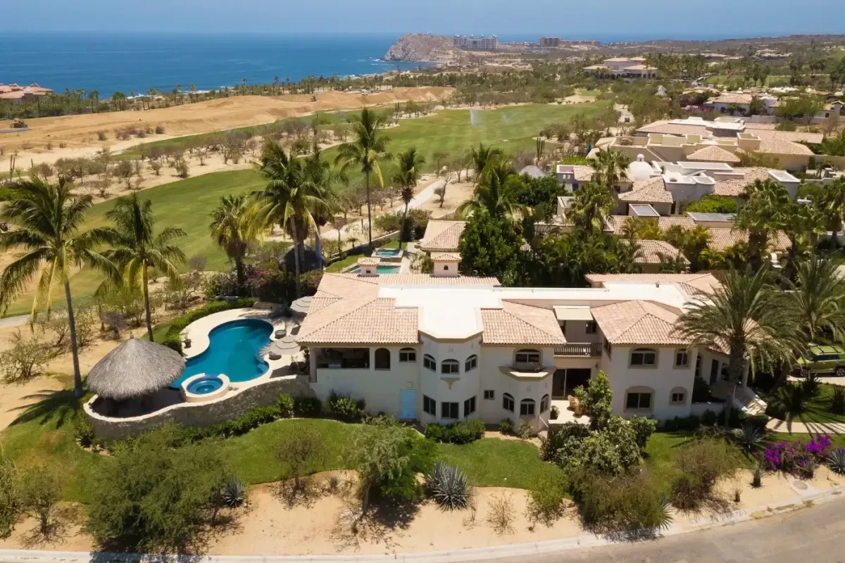 Villa exterior aerial at Villa Esquina with golf course, ocean beyond in Cabo Del Sol